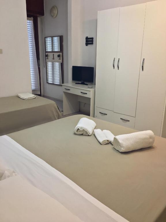 Postel nebo postele na pokoji v ubytování Hotel Due Pini Conte