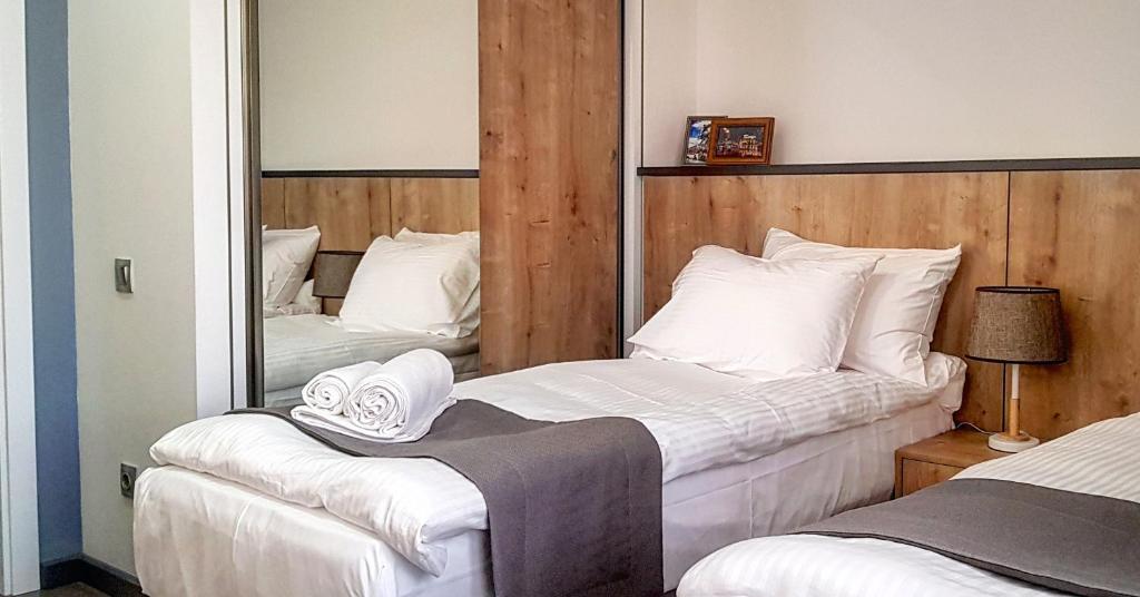Postel nebo postele na pokoji v ubytování Hotel Alpha
