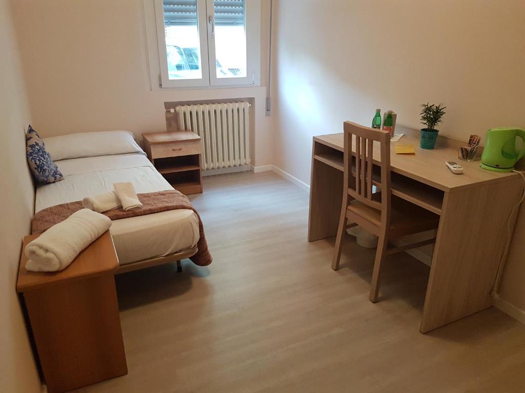 Postel nebo postele na pokoji v ubytování Hotel Damma's, Dipendenza Zamagna