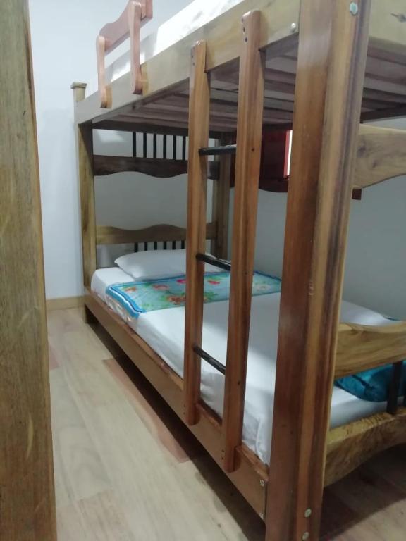 a couple of bunk beds in a room at Elizabetha Hostal in Salento