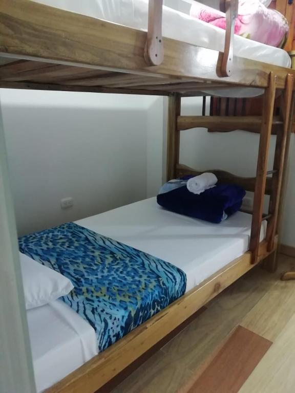 a couple of bunk beds in a room at Elizabetha Hostal in Salento