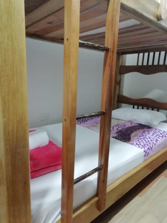 a bunk bed room with two bunk beds at Elizabetha Hostal in Salento