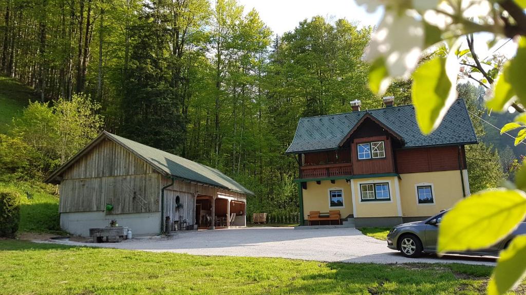 a barn with a car parked in front of it at Ferienhaus Schlossblick in Landl