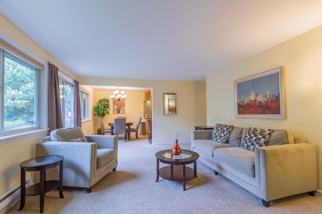 a living room with two couches and a table at the Romeo, Best Area, 2 Bedrooms, WD, Jacuzzi Bath, No Stairs, New Carpet, 825sf in Tacoma