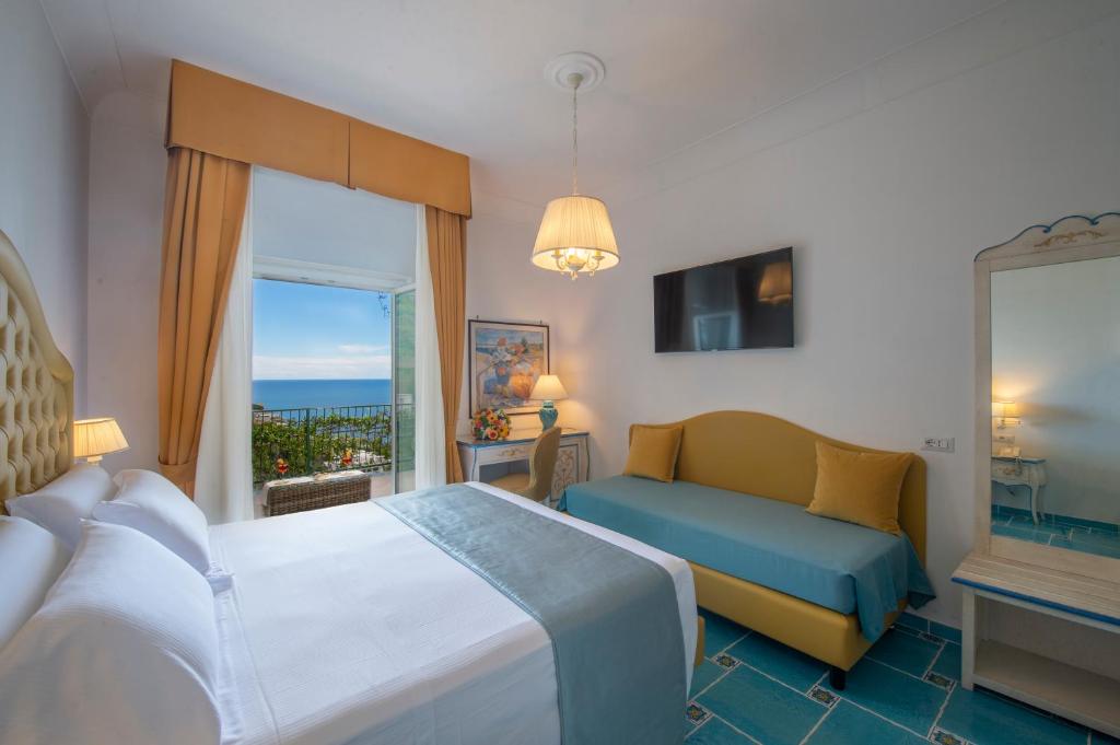 Postel nebo postele na pokoji v ubytování Hotel Pellegrino
