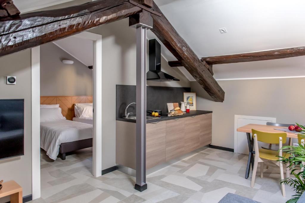 Postel nebo postele na pokoji v ubytování APARTHOTEL CASA MIA