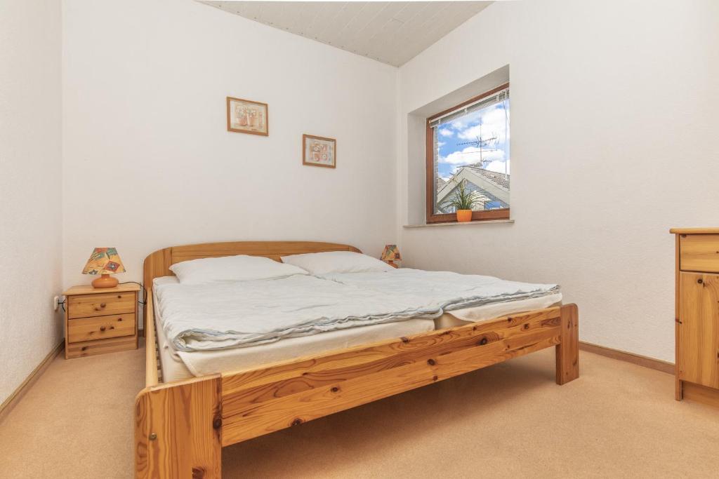 Postel nebo postele na pokoji v ubytování Ostseehaus Petersen