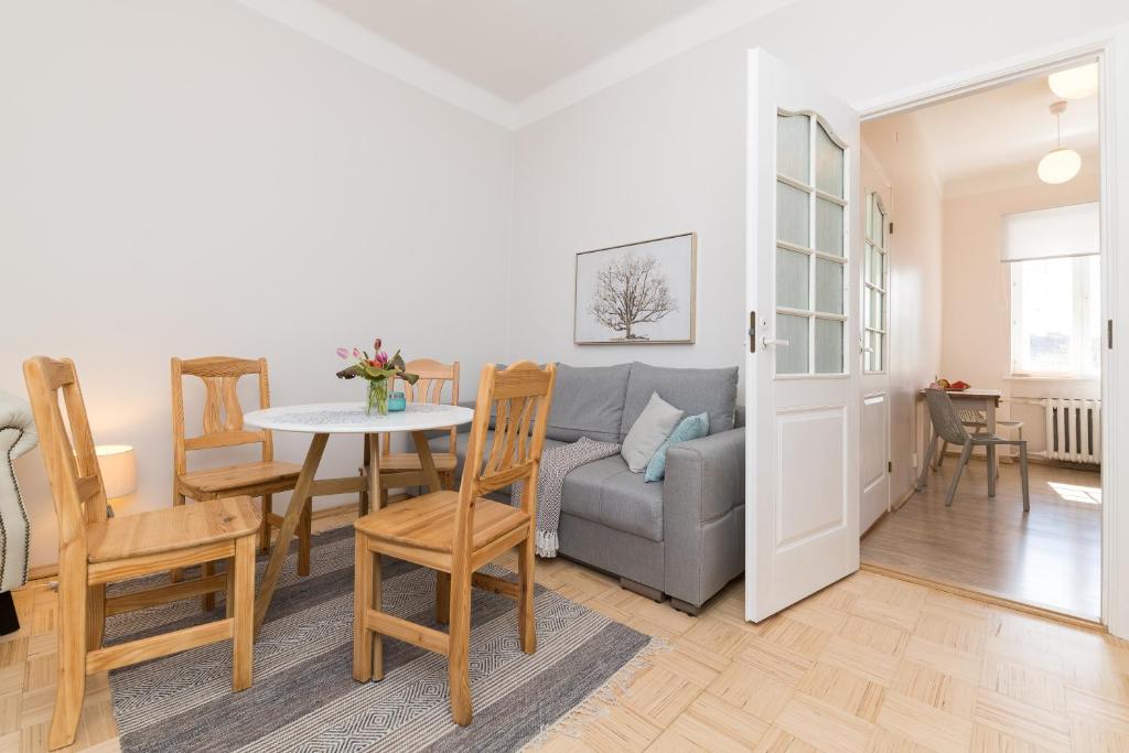 a living room with a couch and a table at Suurkarja Apartment in Tallinn
