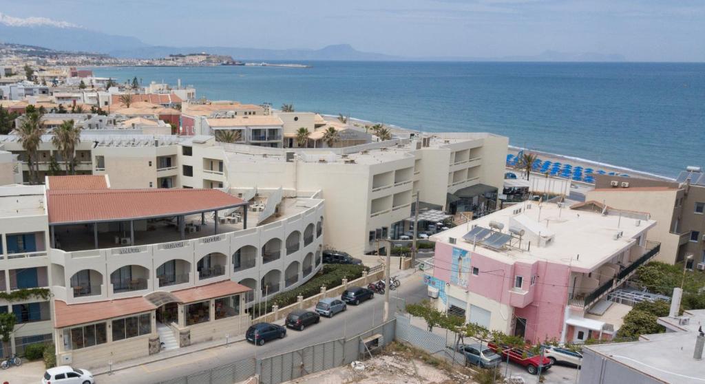 an aerial view of a city and the ocean at Anita Beach Hotel- Adults Only in Rethymno
