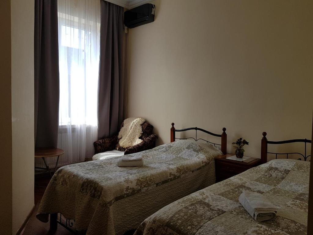 Postel nebo postele na pokoji v ubytování Tamari Guest House