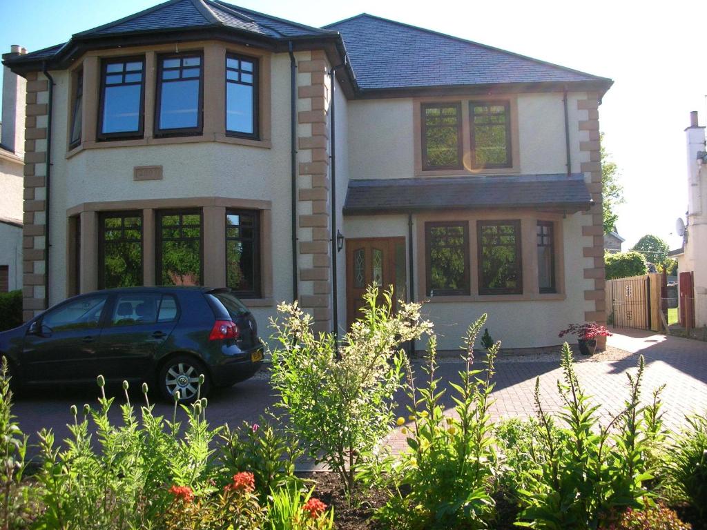 a car parked in front of a house at Arisaig Guest House in Inverness