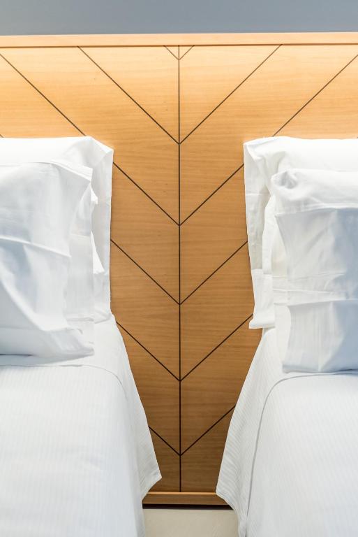 Postel nebo postele na pokoji v ubytování APARTHOTEL CASA MIA