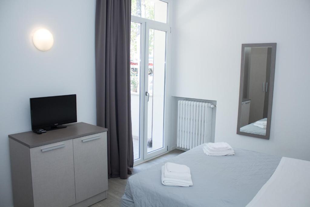 Llit o llits en una habitació de Hotel Stella Polare