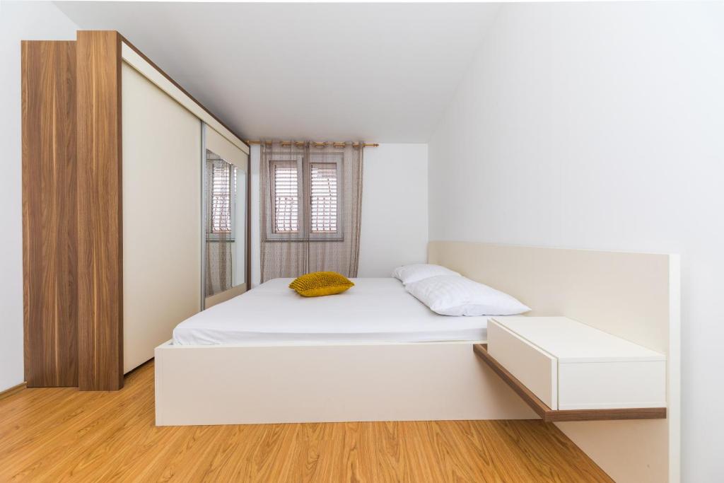 Postel nebo postele na pokoji v ubytování Apartments Gavran