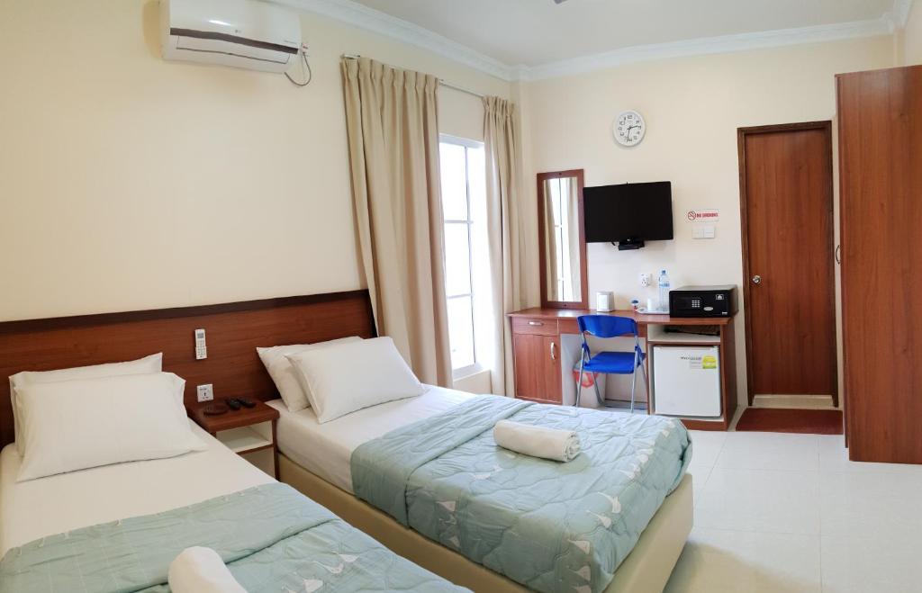 Postel nebo postele na pokoji v ubytování Hulhan'gu Lodge