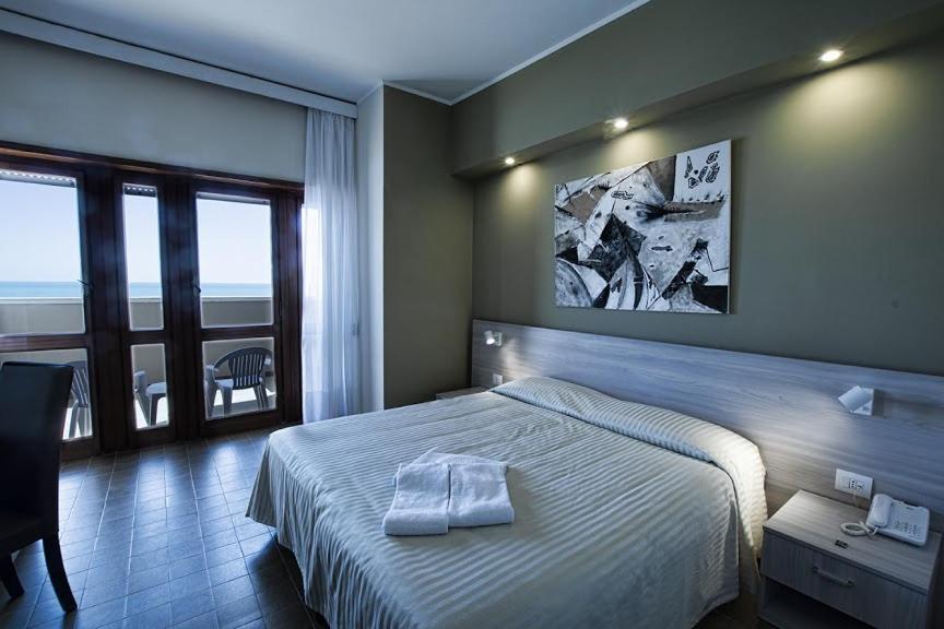 Postel nebo postele na pokoji v ubytování Hotel Scacciapensieri