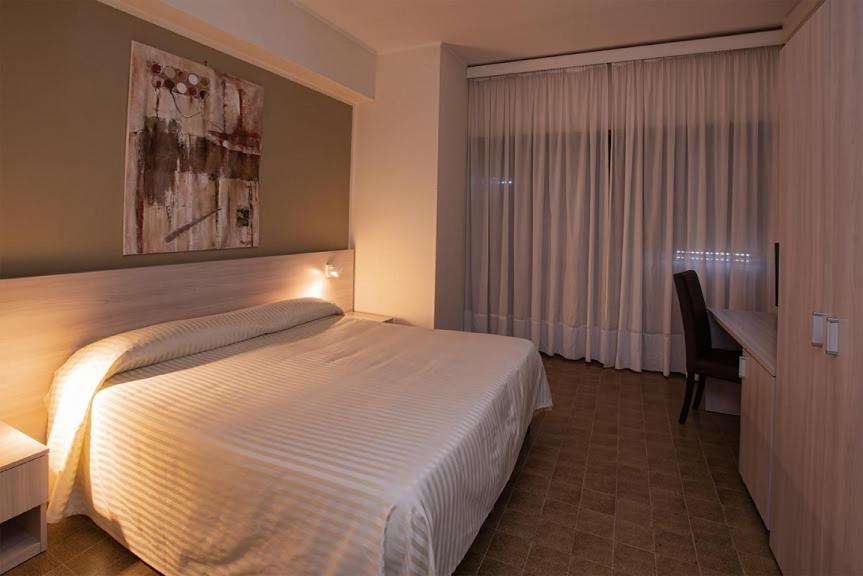 Postel nebo postele na pokoji v ubytování Hotel Scacciapensieri