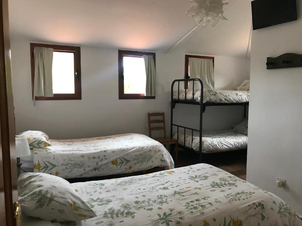 Postel nebo postele na pokoji v ubytování Entrerrobles