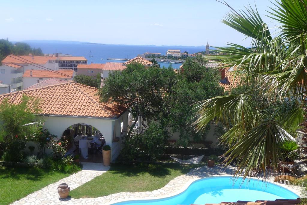 a view of the house from the balcony at Apartments Lorenandreja in Rab