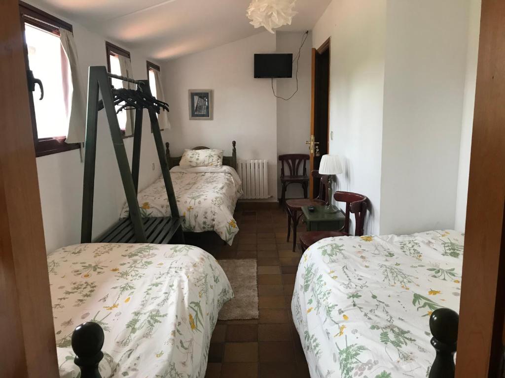 Postel nebo postele na pokoji v ubytování Entrerrobles
