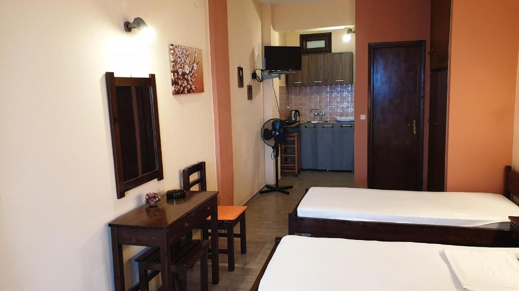 Postel nebo postele na pokoji v ubytování Atisis Apartments
