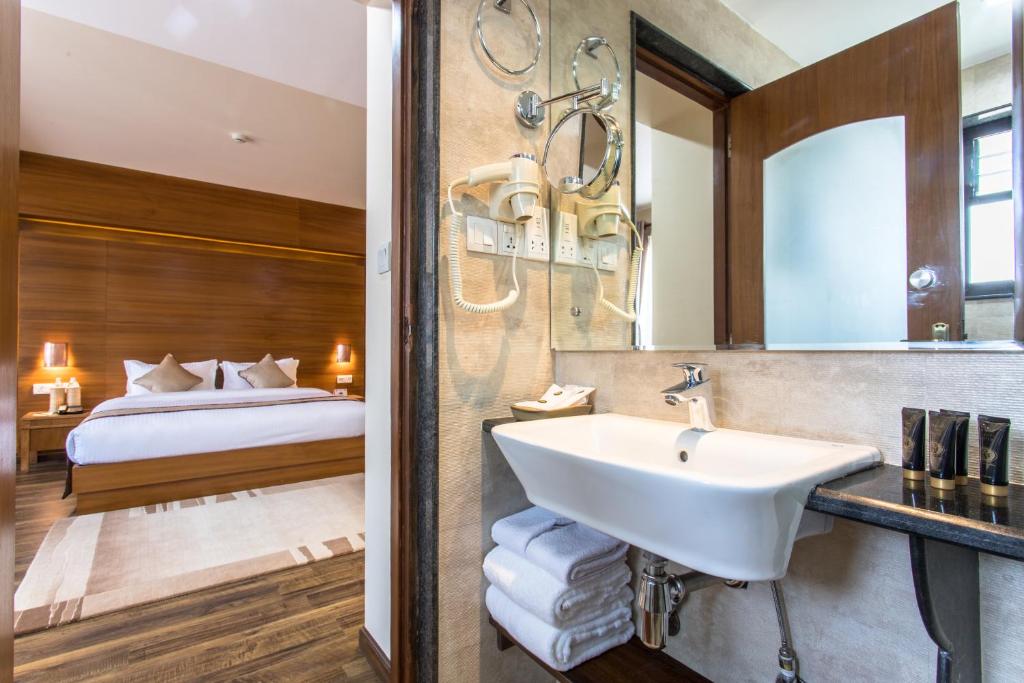 Postel nebo postele na pokoji v ubytování Hotel Kutumba