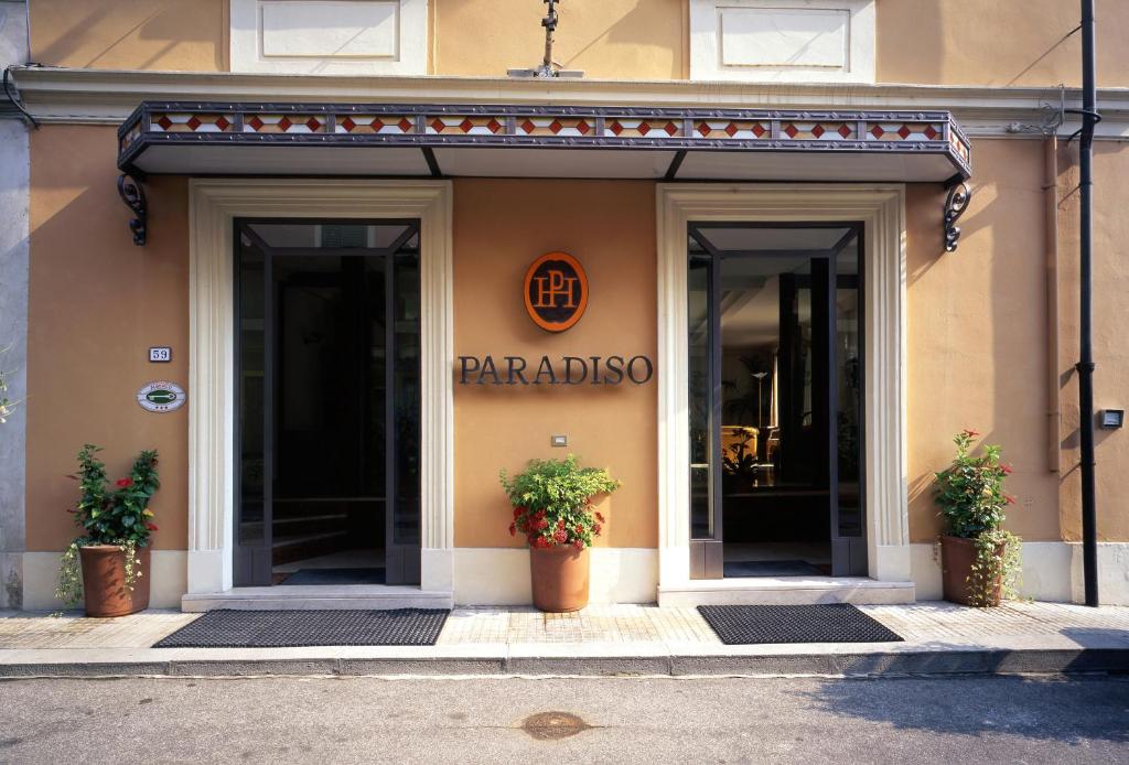 a entrance to a parolis store with two potted plants at Albergo Paradiso in Montecatini Terme