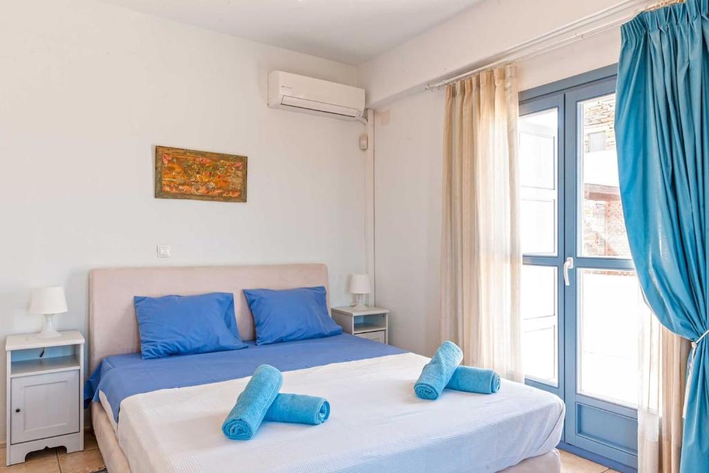 Postel nebo postele na pokoji v ubytování KEA'S VILLA
