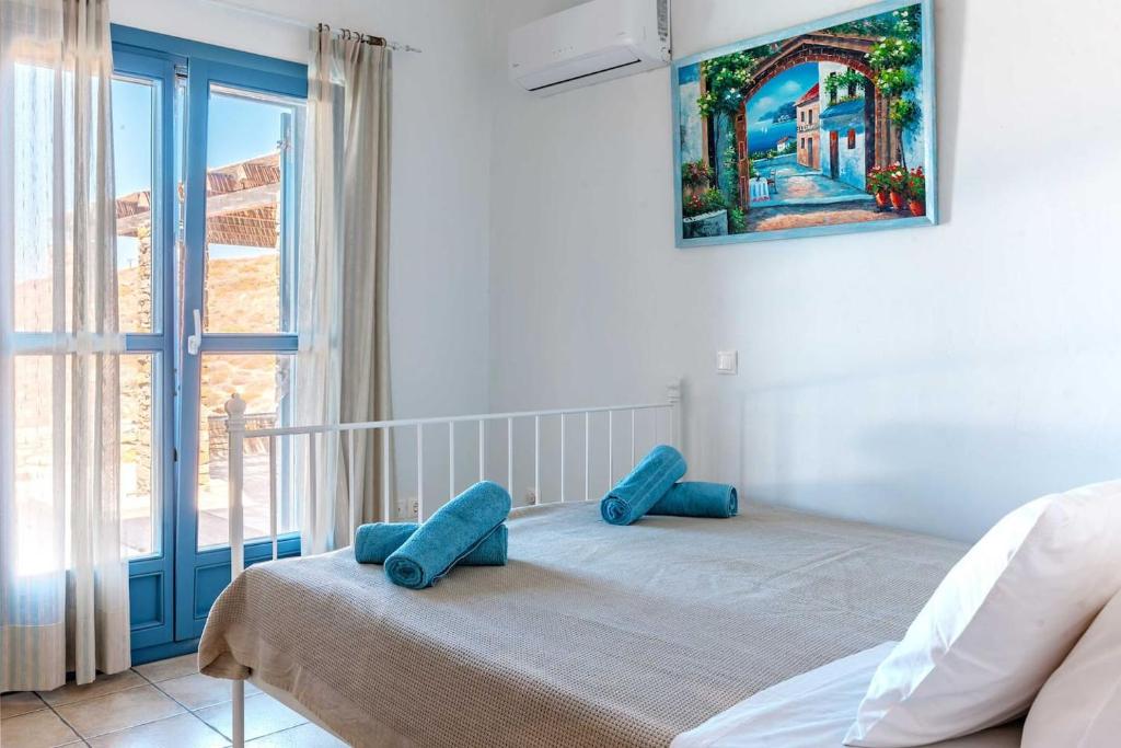 Postel nebo postele na pokoji v ubytování KEA'S VILLA