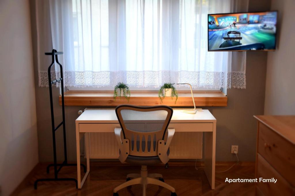 Televízia a/alebo spoločenská miestnosť v ubytovaní Biały Dom - 2 Bedrooms