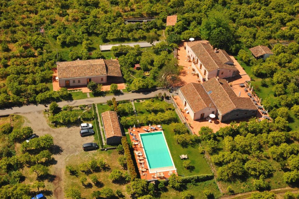 an aerial view of a house with a pool at Galea Farm House in Riposto
