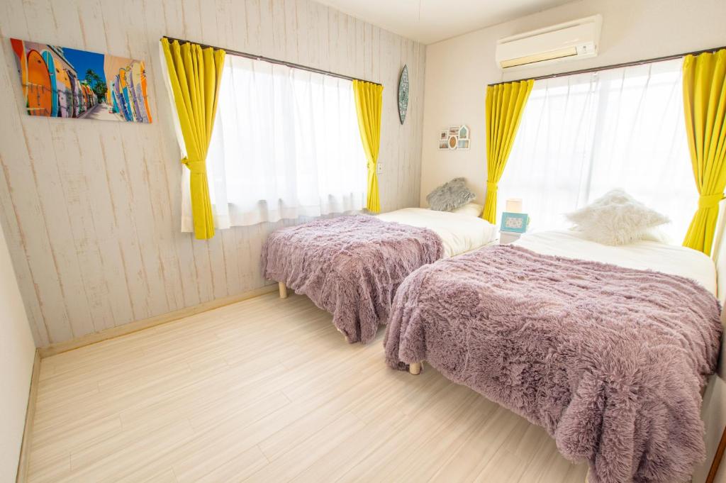 Postel nebo postele na pokoji v ubytování Villent Kujukuri Ocean 1