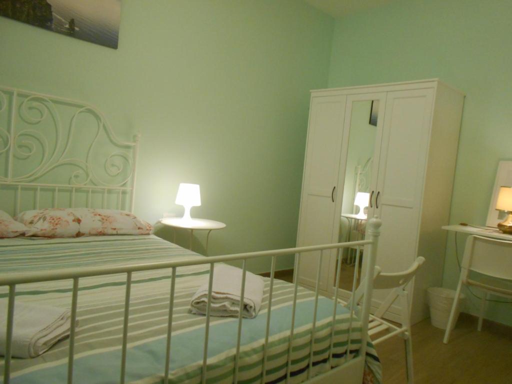 Кровать или кровати в номере L'Oleandro di Alfredo