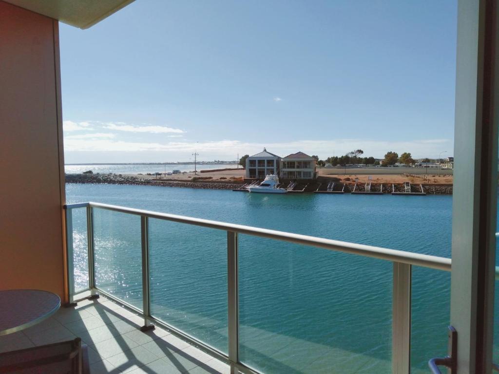 a balcony with a view of a body of water at Wallaroo Marina Executive Apartments in Wallaroo