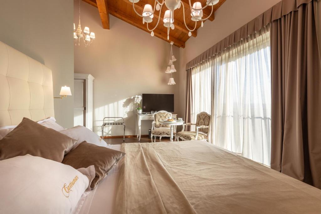 Postel nebo postele na pokoji v ubytování Wine Residence Cattunar