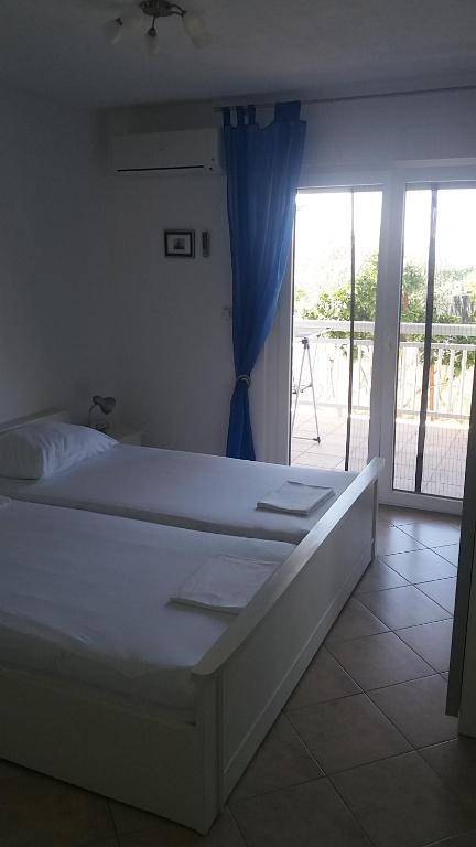 Posteľ alebo postele v izbe v ubytovaní Apartment Elena