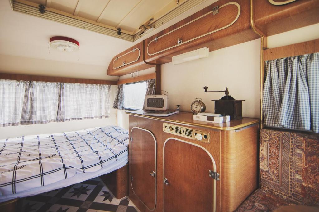 Postel nebo postele na pokoji v ubytování Voyage Spatio-Temporel