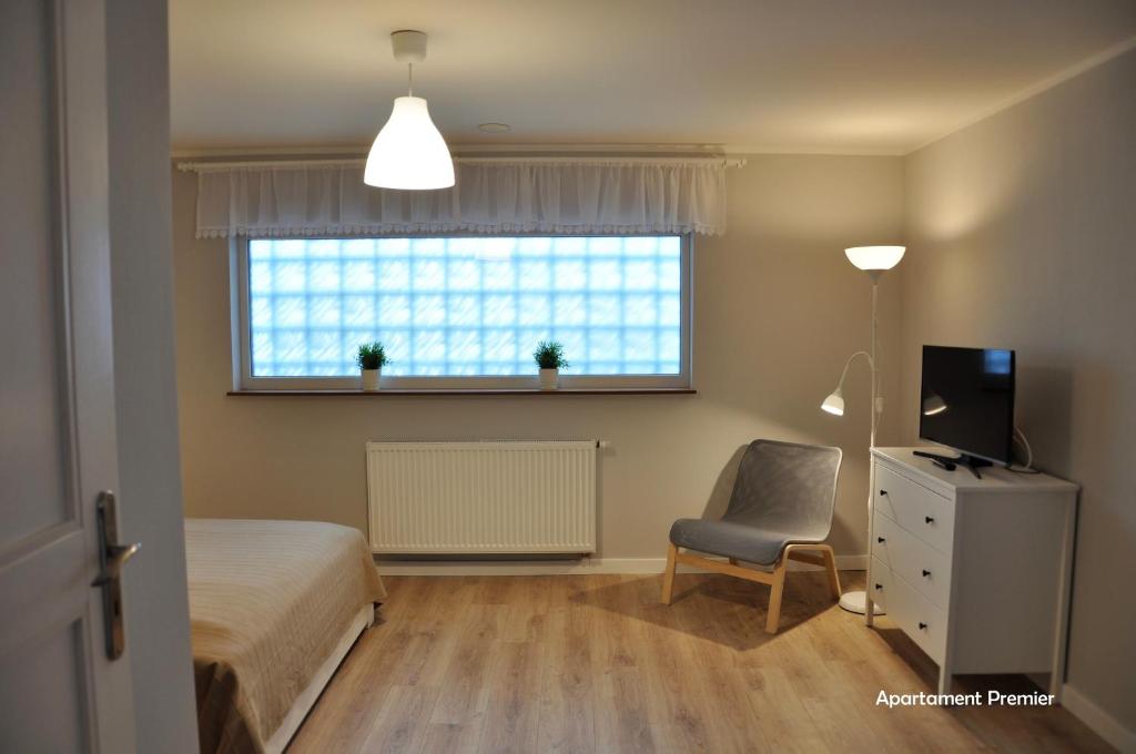 Televízia a/alebo spoločenská miestnosť v ubytovaní Biały Dom - 2 Bedrooms