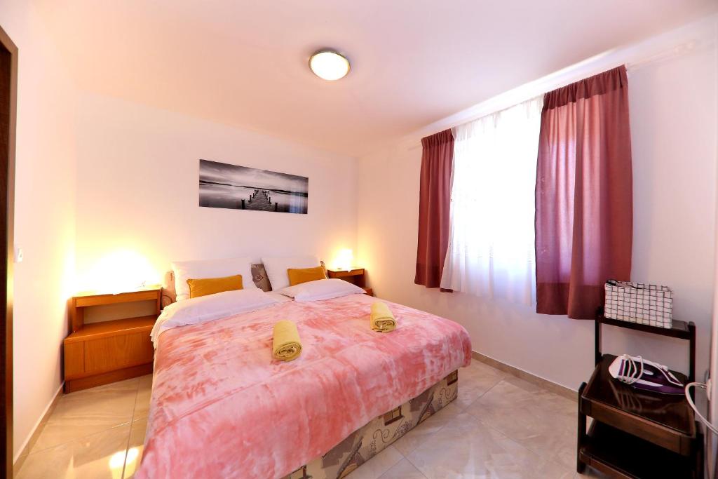 Postel nebo postele na pokoji v ubytování Apartments Anka