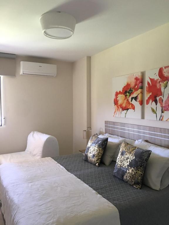 Postel nebo postele na pokoji v ubytování Luxury Apartamento Minerva Júpiter