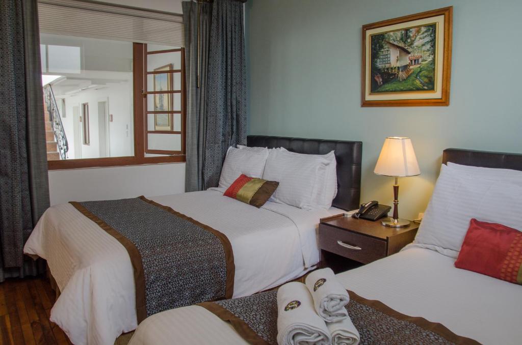 Postel nebo postele na pokoji v ubytování Hotel Shalom
