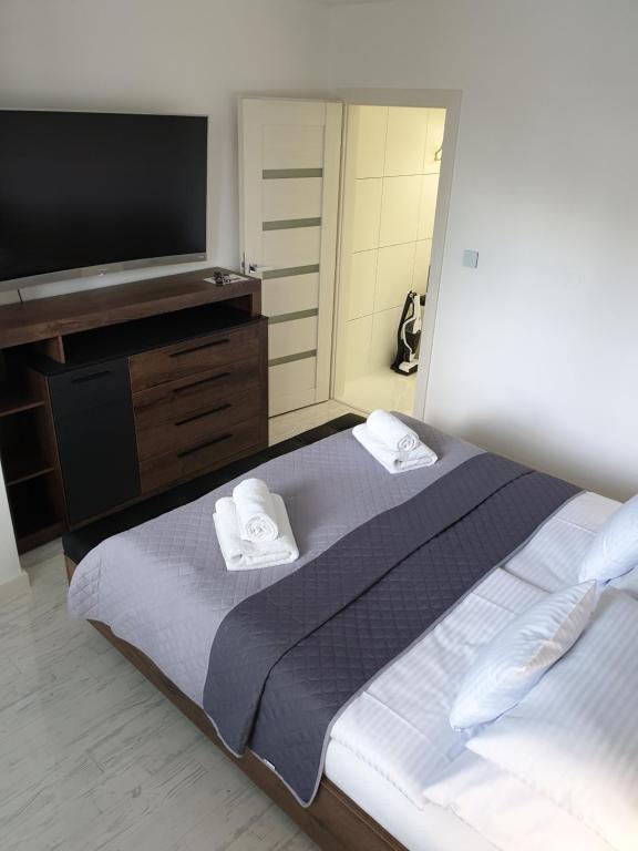 Postel nebo postele na pokoji v ubytování Apartmány Urban