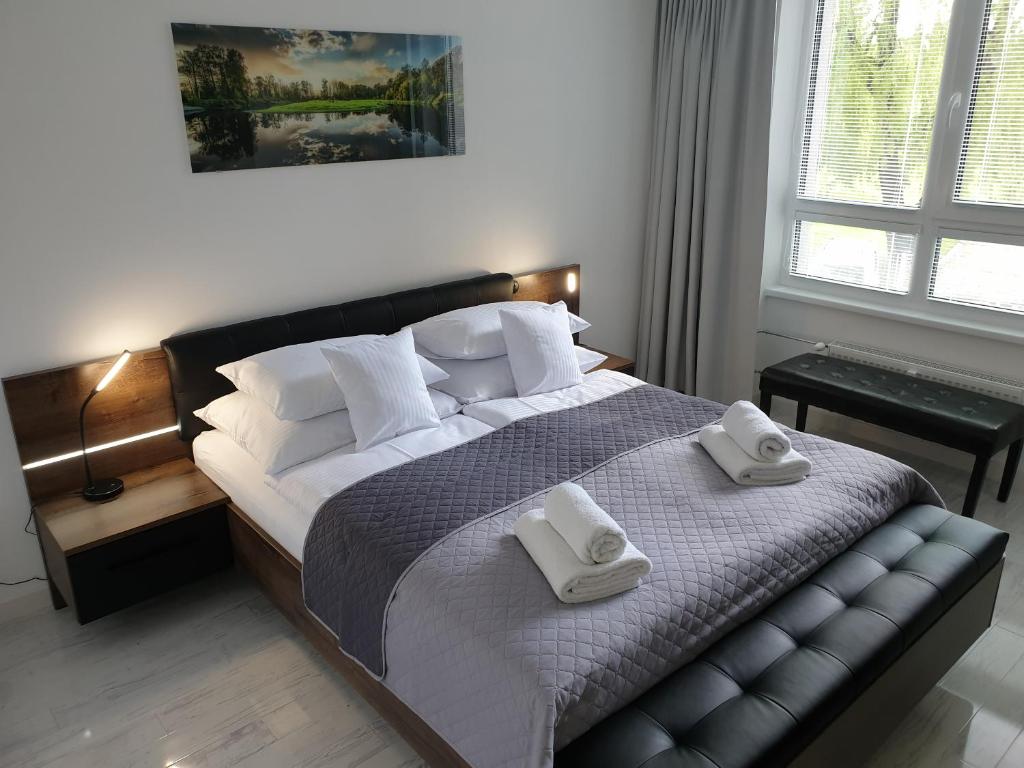 Postel nebo postele na pokoji v ubytování Apartmány Urban