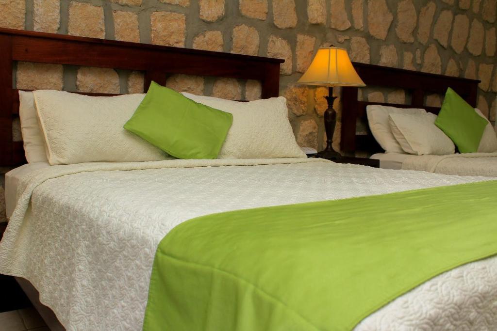 Postel nebo postele na pokoji v ubytování Plaza Magdalena Hotel