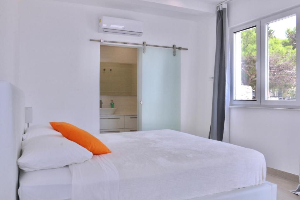 Posteľ alebo postele v izbe v ubytovaní Villa Mel II