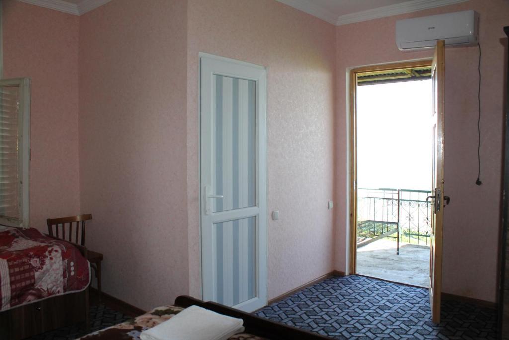 Postel nebo postele na pokoji v ubytování Guest House Shota