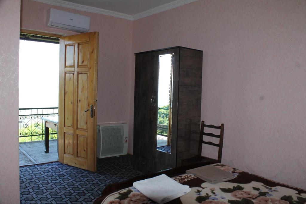 Postel nebo postele na pokoji v ubytování Guest House Shota