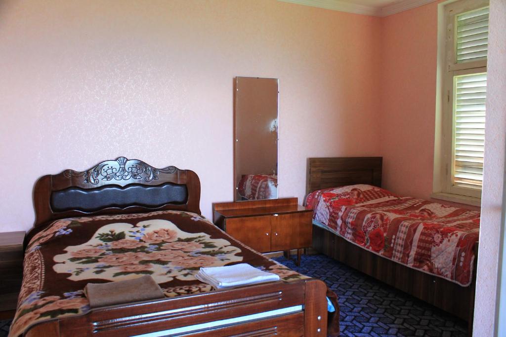 Postel nebo postele na pokoji v ubytování Guest House Shota