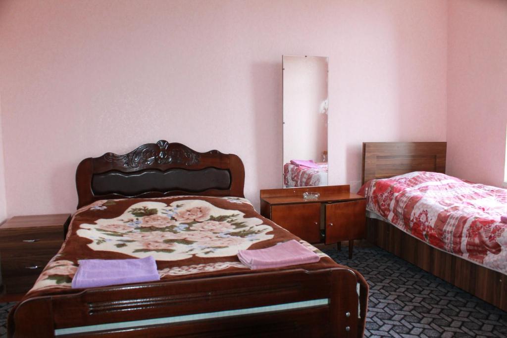 Postel nebo postele na pokoji v ubytování Guest House Shota