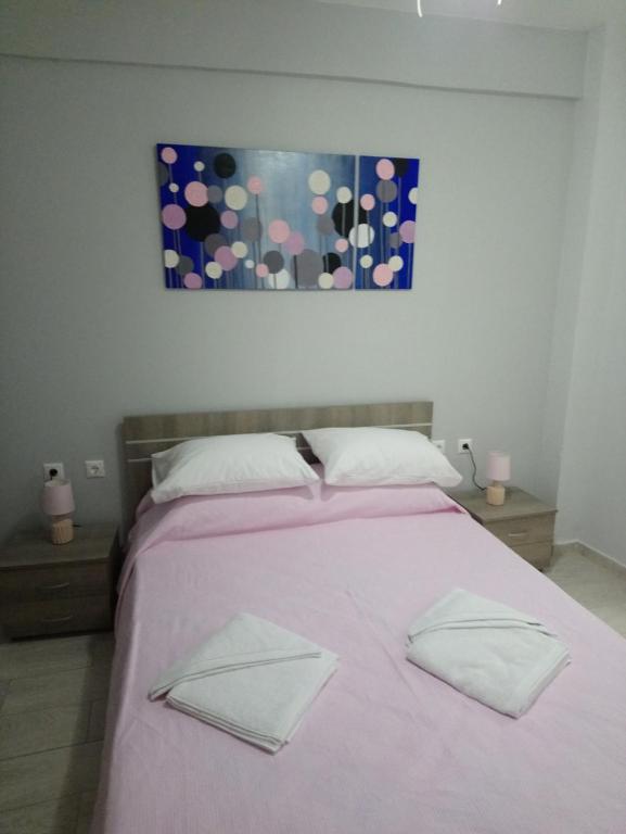 Postel nebo postele na pokoji v ubytování JK's GUESTHOUSE KARDAMAINA